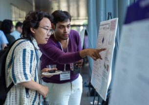 students looking at poster